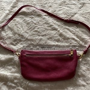 Anthropologie slim cross-body/waist bag. Raspberry color.